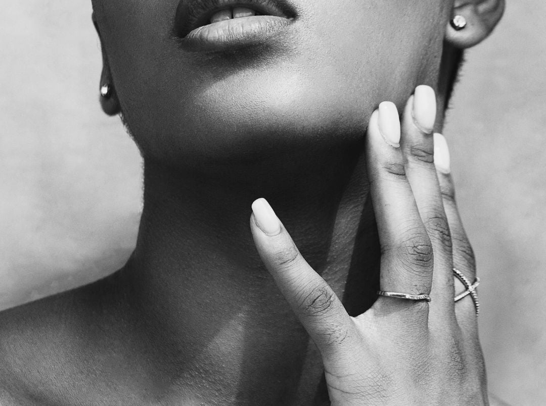 Woman_touching_her_face