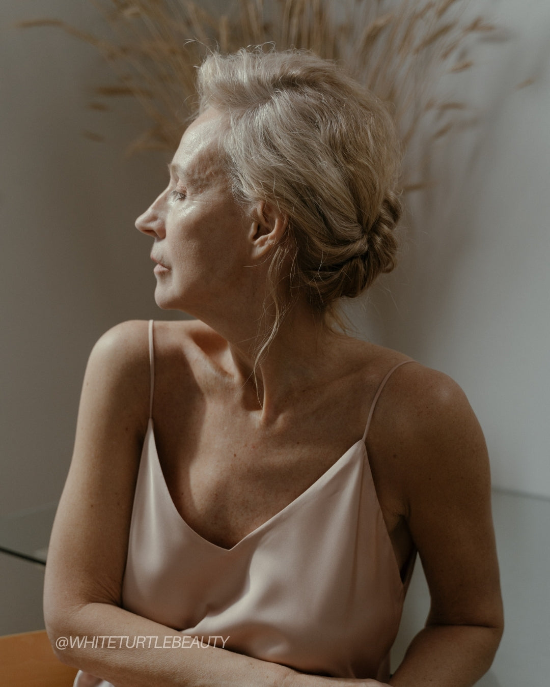 Nervous system skincare — applying botanical balm to calm stressed skin