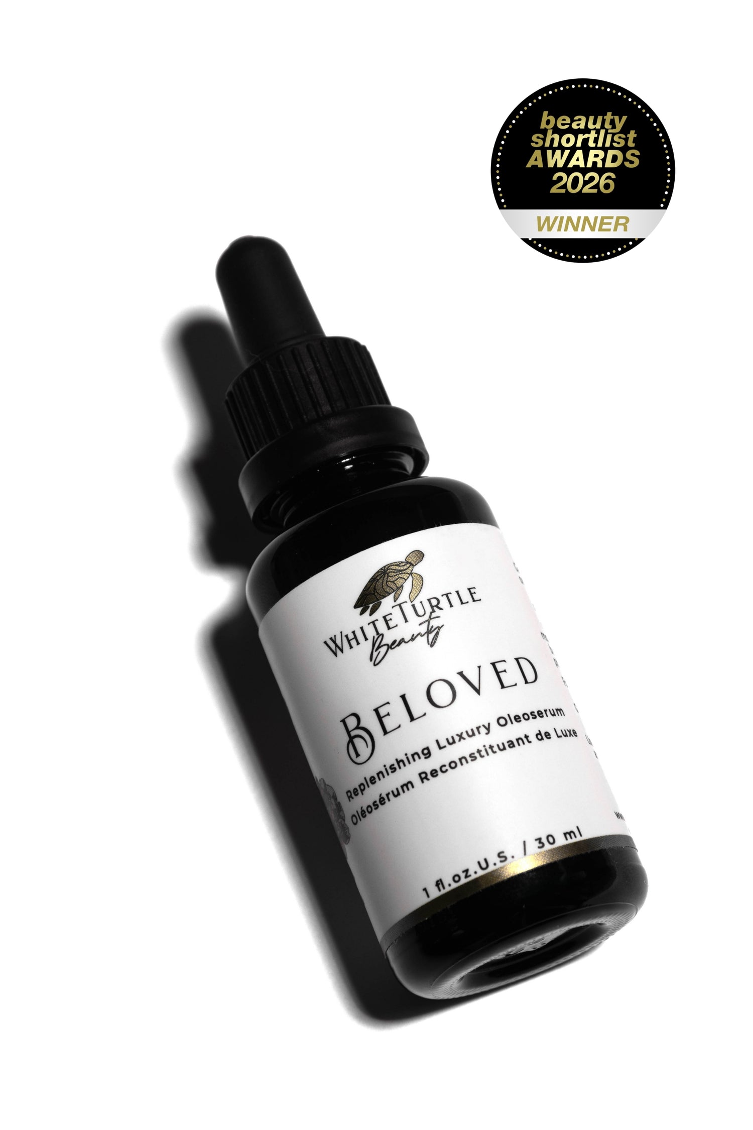 Bottle of 'Beloved' serum by White Turtle Beauty with a 'Winner' badge on a white background