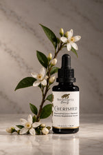 A small dropper bottle labeled White Turtle Beauty Cherished 