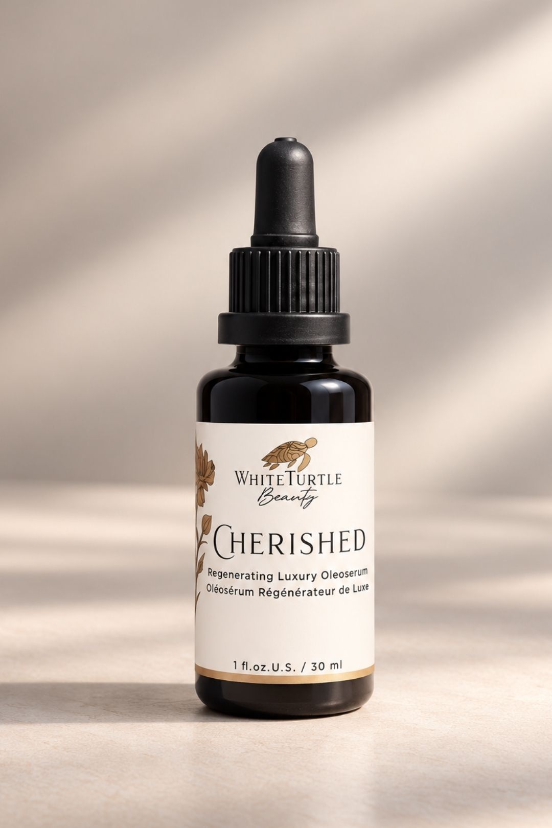 A bottle of White Turtle Beauty CHERISHED Regenerating Luxury Oleoserum in beige background
