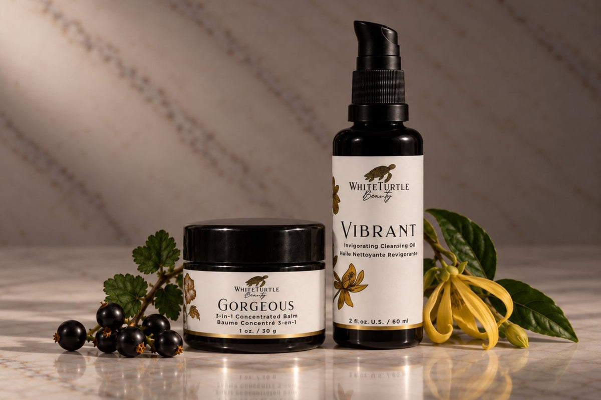 A white turtle beauty set featuring a jar of Gorgeous  Balm and a pump bottle of Vibrant Cleansing Oil