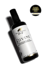 Bottle of Divine body serum from White Turtle Beauty with a 'Winner' badge on a white background
