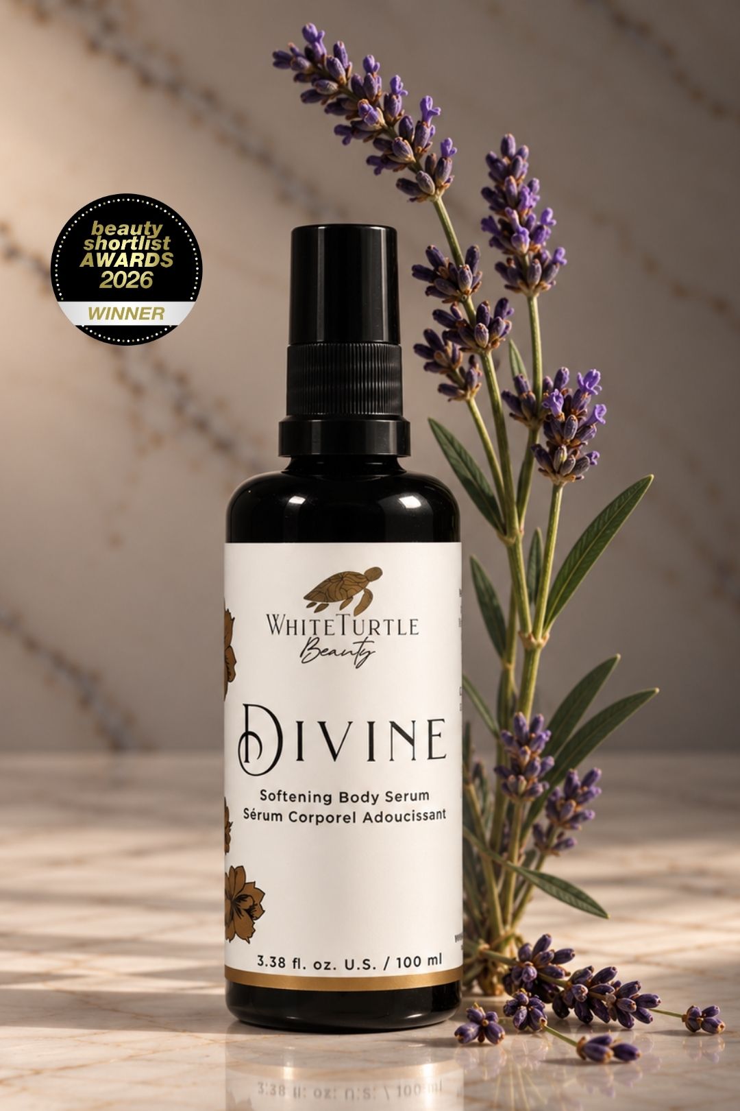 White Turtle Beauty Divine Softening Body Serum in a dark glass spray bottle, styled with fresh lavender sprigs