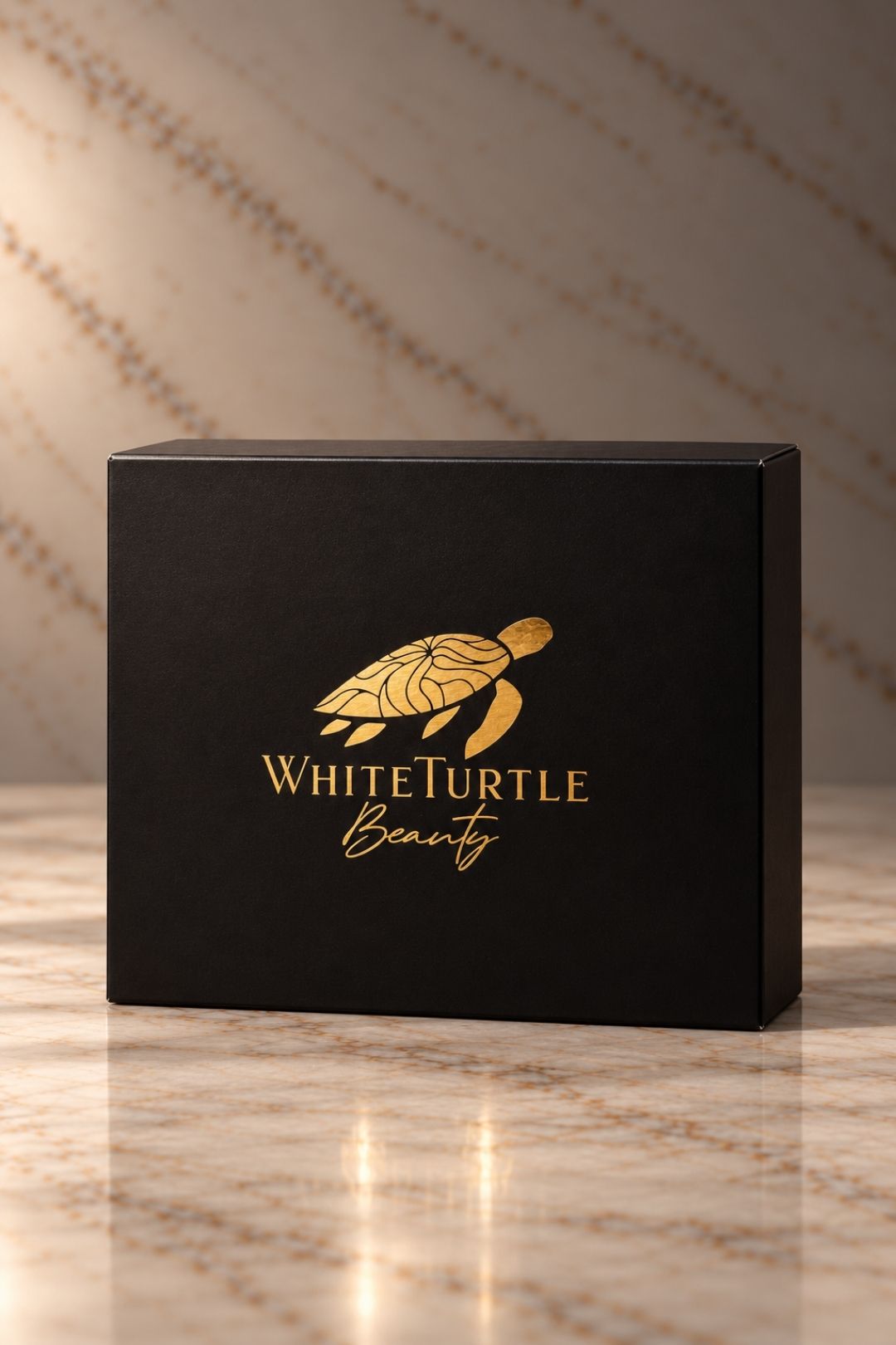 A black gift product box with a gold turtle logo and the text 'White Turtle Beauty' 